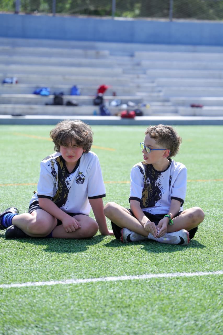 Two players chatting on the bench