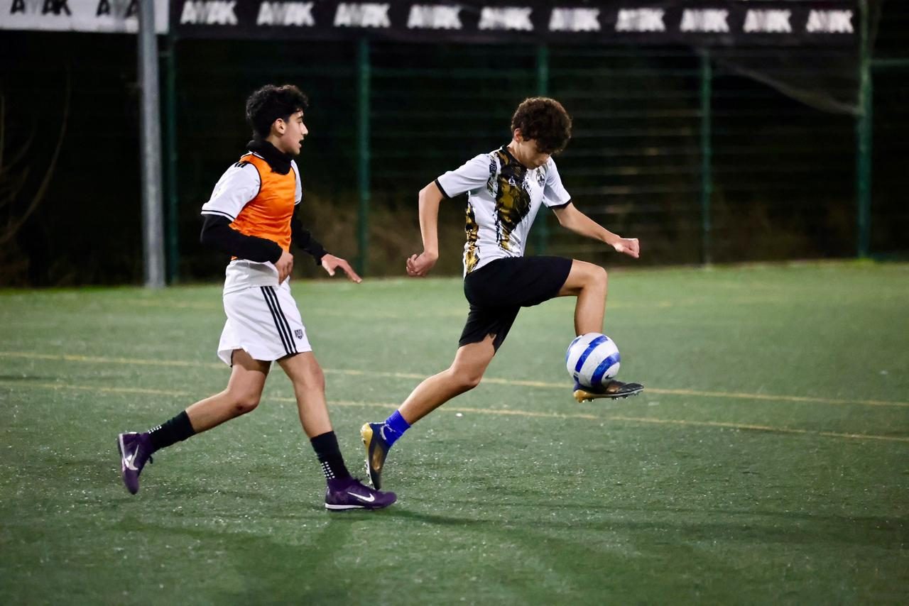 Two players practicing dribbling